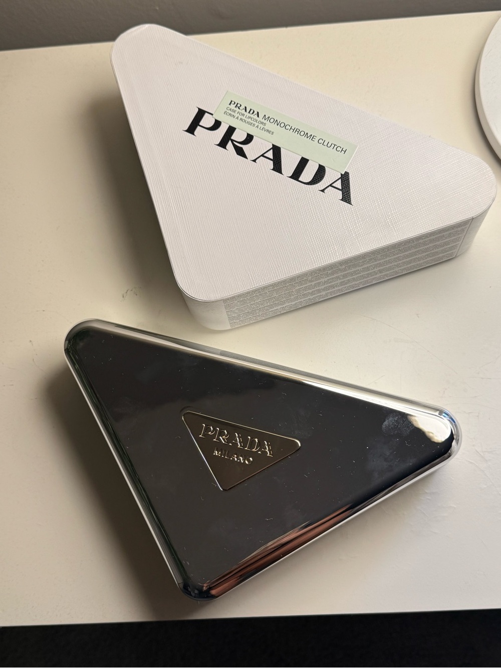 Prada Triangular Metal Clutch in Reflective Silver